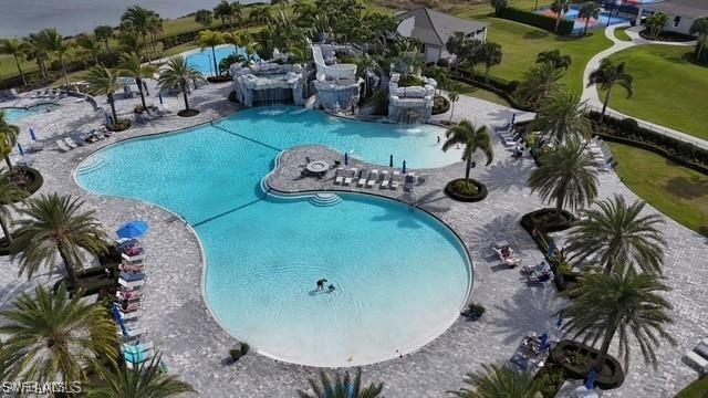 19694 Deming Ln, Estero, FL 33928 - community pool with a patio