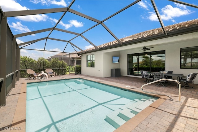 19694 Deming Ln, Estero, FL 33928 - outdoor pool featuring a patio, a ceiling fan, and glass enclosure