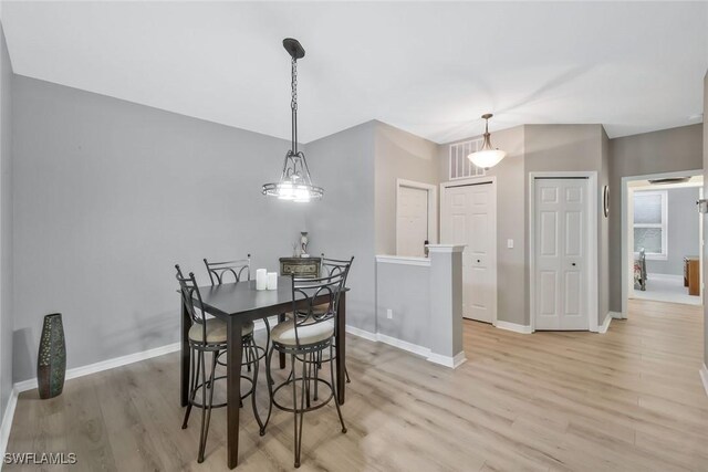 1340 Charleston Square Dr Unit 101, Naples, FL 34110 - dining space featuring light wood-style floors and baseboards