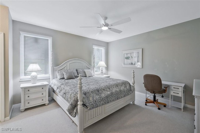 1340 Charleston Square Dr Unit 101, Naples, FL 34110 - bedroom with light colored carpet, baseboards, and a ceiling fan