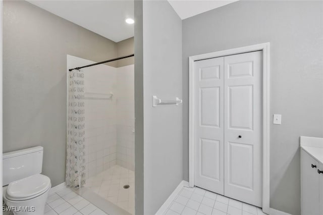 1340 Charleston Square Dr Unit 101, Naples, FL 34110 - bathroom with toilet, a tile shower, and tile patterned floors