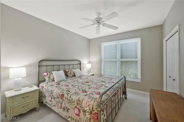 1340 Charleston Square Dr Unit 101, Naples, FL 34110 - bedroom with light colored carpet, baseboards, and ceiling fan