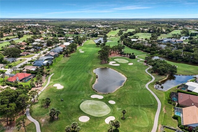 1340 Charleston Square Dr Unit 101, Naples, FL 34110 - aerial view of property and surrounding area with a nearby body of water, nearby suburban area, and a golf course