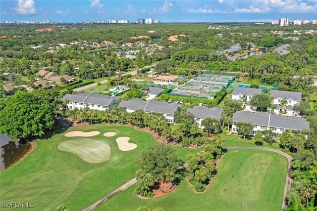 1340 Charleston Square Dr Unit 101, Naples, FL 34110 - aerial view of property's location with a golf club, a tree filled landscape, and nearby suburban area