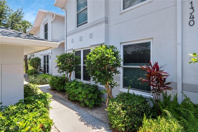 1340 Charleston Square Dr Unit 101, Naples, FL 34110 - view of side of property with stucco siding