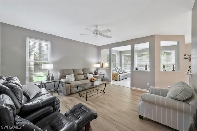 1340 Charleston Square Dr Unit 101, Naples, FL 34110 - living room with a ceiling fan, light wood-type flooring, and baseboards