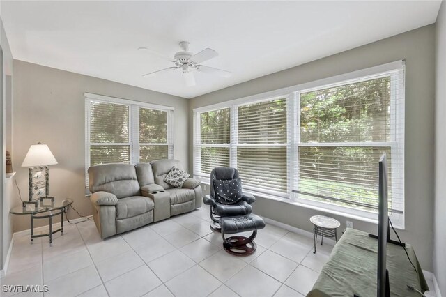 1340 Charleston Square Dr Unit 101, Naples, FL 34110 - living room with healthy amount of natural light, a ceiling fan, and light tile patterned floors