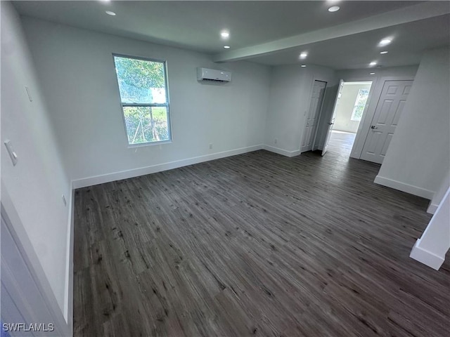 5981 Cubles Dr, Bokeelia, FL 33922 - spare room with a wall mounted air conditioner, dark wood finished floors, baseboards, and recessed lighting