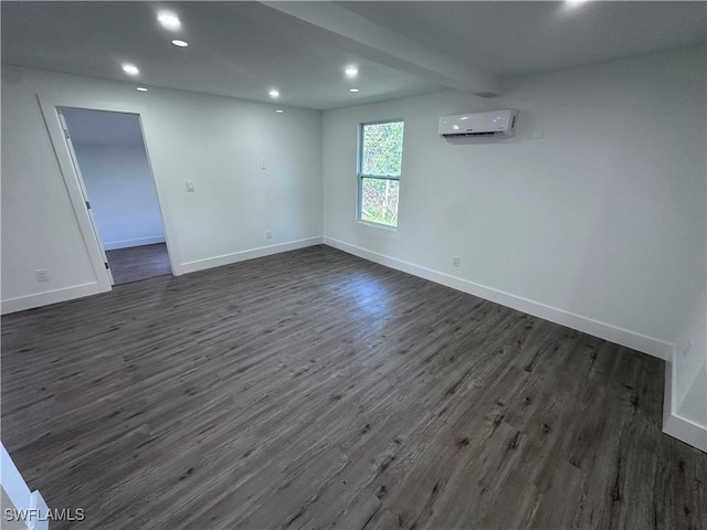 5981 Cubles Dr, Bokeelia, FL 33922 - spare room featuring a wall unit AC, dark wood-type flooring, recessed lighting, and baseboards