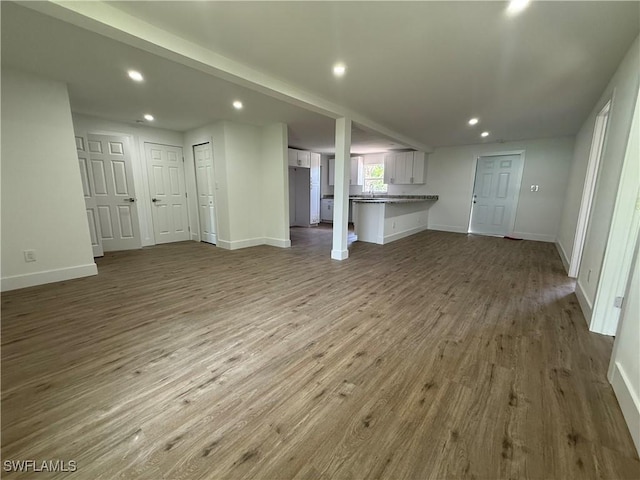 5981 Cubles Dr, Bokeelia, FL 33922 - unfurnished living room with recessed lighting and wood finished floors