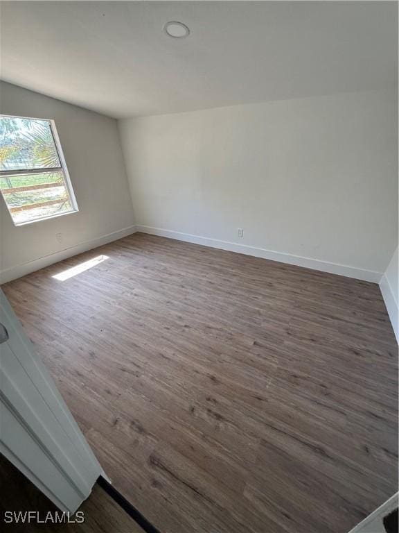 5981 Cubles Dr, Bokeelia, FL 33922 - spare room featuring dark wood-style flooring