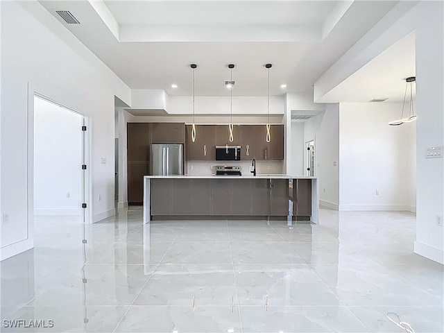 323 NE 19th Ter, Cape Coral, FL 33909 - kitchen with appliances with stainless steel finishes, light countertops, modern cabinets, hanging light fixtures, and recessed lighting