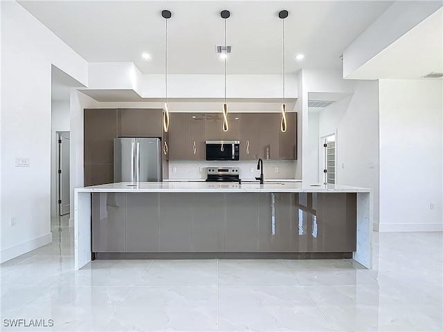 323 NE 19th Ter, Cape Coral, FL 33909 - kitchen with appliances with stainless steel finishes, light countertops, a sink, modern cabinets, and recessed lighting