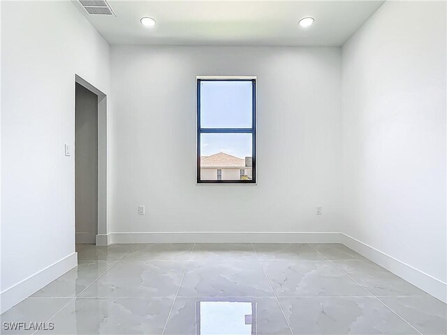 323 NE 19th Ter, Cape Coral, FL 33909 - unfurnished room with baseboards and recessed lighting