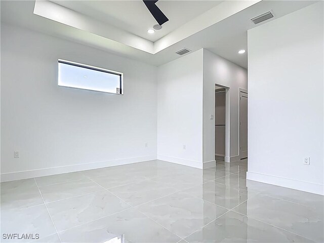 323 NE 19th Ter, Cape Coral, FL 33909 - spare room featuring baseboards and recessed lighting
