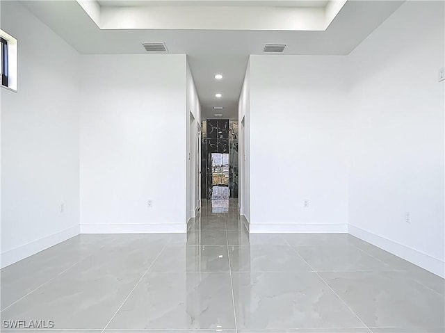 323 NE 19th Ter, Cape Coral, FL 33909 - empty room featuring baseboards and a tray ceiling