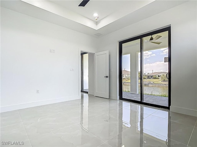 323 NE 19th Ter, Cape Coral, FL 33909 - empty room with baseboards and a ceiling fan