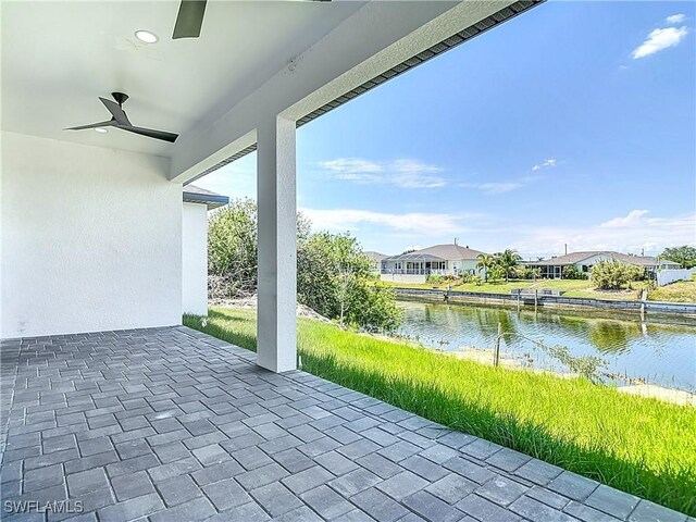 323 NE 19th Ter, Cape Coral, FL 33909 - view of patio featuring a water view, a ceiling fan, and a residential view