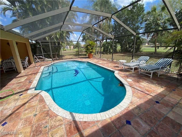 19966 Lake Vista Cir, Lehigh Acres, FL 33936 - outdoor pool with a patio area and glass enclosure