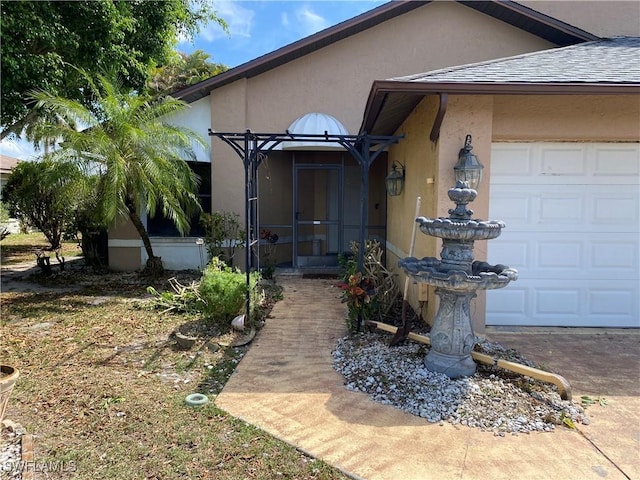 19966 Lake Vista Cir, Lehigh Acres, FL 33936 - doorway to property featuring stucco siding and roof with shingles