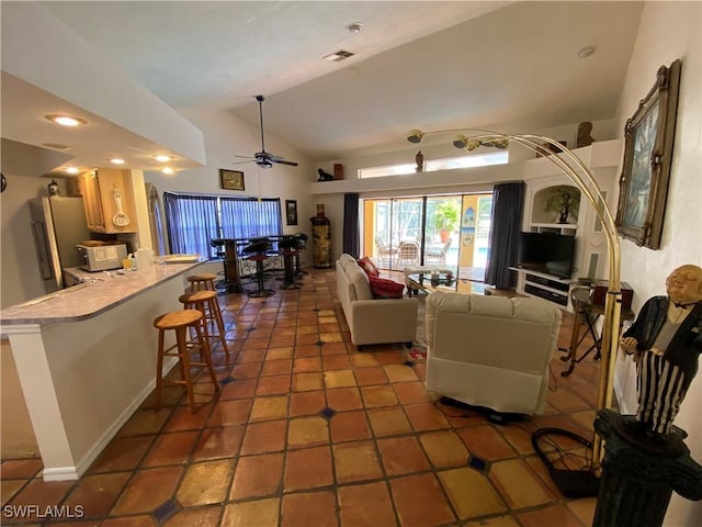 19966 Lake Vista Cir, Lehigh Acres, FL 33936 - living room featuring vaulted ceiling and a ceiling fan