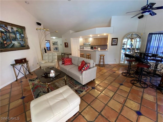 19966 Lake Vista Cir, Lehigh Acres, FL 33936 - living room featuring ceiling fan, light tile patterned floors, high vaulted ceiling, and baseboards