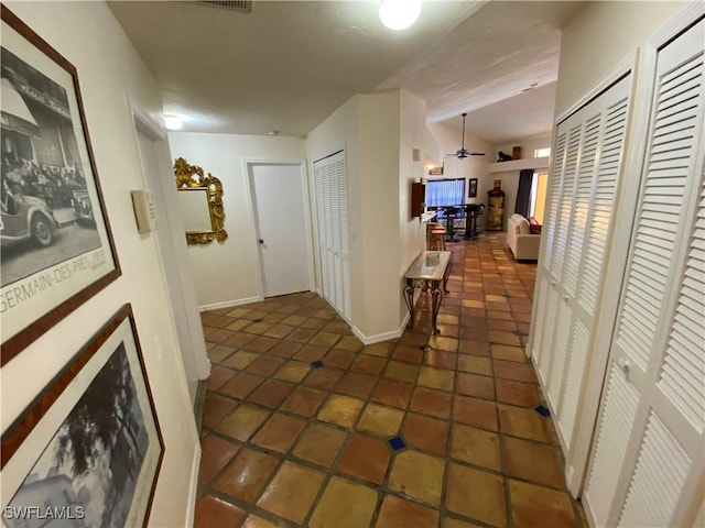 19966 Lake Vista Cir, Lehigh Acres, FL 33936 - hall with vaulted ceiling and baseboards