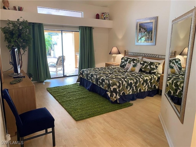19966 Lake Vista Cir, Lehigh Acres, FL 33936 - bedroom featuring access to outside and wood finished floors
