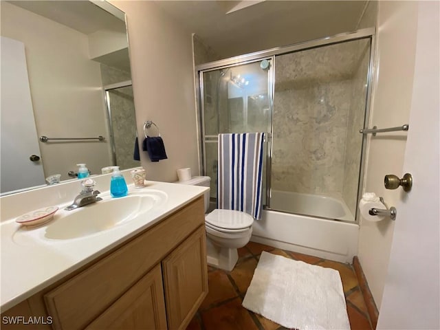 19966 Lake Vista Cir, Lehigh Acres, FL 33936 - bathroom with shower / bath combination with glass door, toilet, vanity, and tile patterned floors