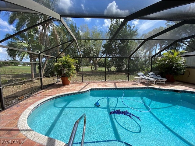 19966 Lake Vista Cir, Lehigh Acres, FL 33936 - swimming pool with a patio and glass enclosure
