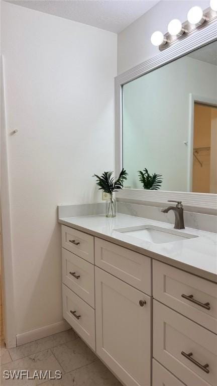 3916 SE 11th Pl Unit 503, Cape Coral, FL 33904 - bathroom featuring vanity and baseboards