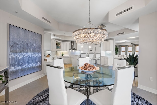 14270 Royal Harbour Ct Unit 920, Fort Myers, FL 33908 - dining area featuring a chandelier, baseboards, and light tile patterned floors