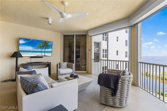 14270 Royal Harbour Ct Unit 920, Fort Myers, FL 33908 - sunroom / solarium with a water view, a wall of windows, a textured ceiling, and healthy amount of natural light