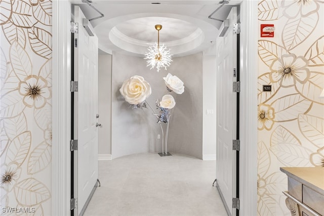14270 Royal Harbour Ct Unit 920, Fort Myers, FL 33908 - hall featuring arched walkways, a chandelier, and a raised ceiling