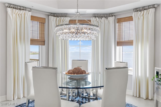14270 Royal Harbour Ct Unit 920, Fort Myers, FL 33908 - dining room with a chandelier, healthy amount of natural light, and baseboards