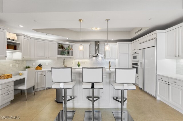 14270 Royal Harbour Ct Unit 920, Fort Myers, FL 33908 - kitchen featuring wall chimney exhaust hood, open shelves, paneled built in refrigerator, a tray ceiling, and recessed lighting