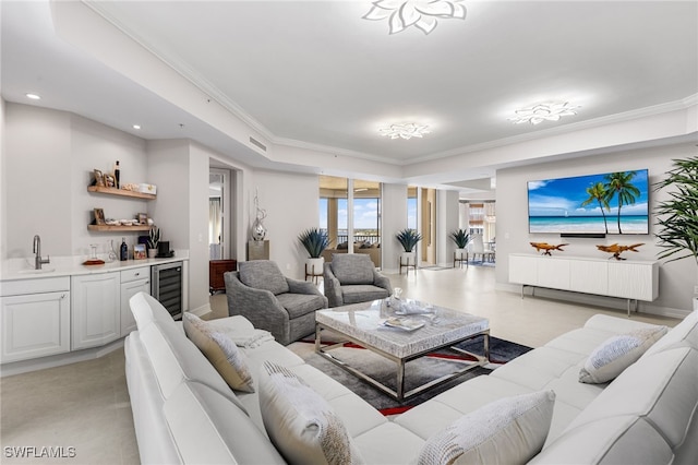 14270 Royal Harbour Ct Unit 920, Fort Myers, FL 33908 - living room featuring wet bar, wine cooler, a tray ceiling, crown molding, and recessed lighting