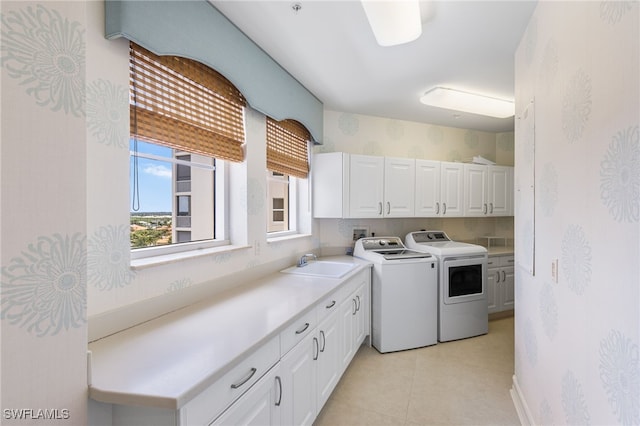 14270 Royal Harbour Ct Unit 920, Fort Myers, FL 33908 - laundry area with cabinet space, washer and dryer, wallpapered walls, and light tile patterned flooring