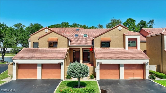 7121 Golden Eagle Ct Unit 622, Fort Myers, FL 33912 - multi unit property with a tiled roof, driveway, stucco siding, and an attached garage