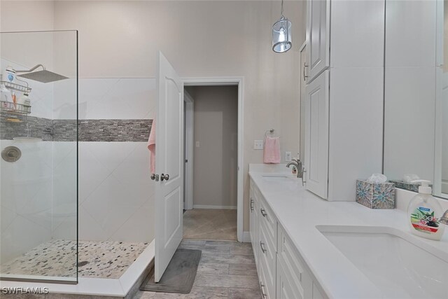 607 92nd Ave N, Naples, FL 34108 - full bath featuring a walk in shower, double vanity, and wood finished floors