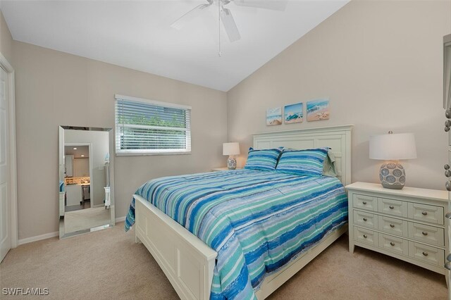 607 92nd Ave N, Naples, FL 34108 - bedroom featuring light carpet, vaulted ceiling, baseboards, and a ceiling fan