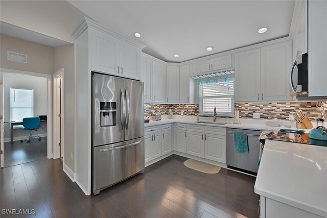 607 92nd Ave N, Naples, FL 34108 - kitchen featuring appliances with stainless steel finishes, a sink, light countertops, a desk, and white cabinets