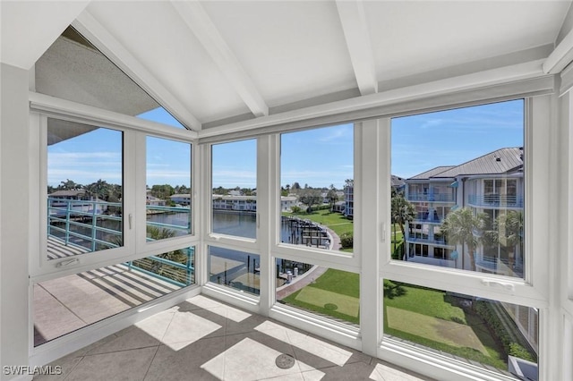 255 Park Shore Dr Unit 3-341, Naples, FL 34103 - unfurnished sunroom featuring a water view and tile patterned floors