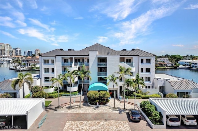 255 Park Shore Dr Unit 3-341, Naples, FL 34103 - view of building exterior with a water view