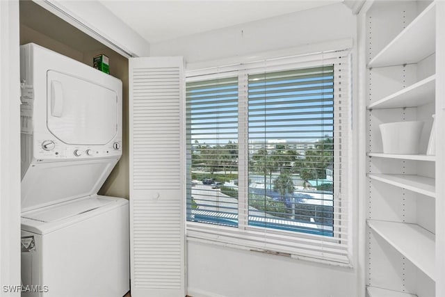255 Park Shore Dr Unit 3-341, Naples, FL 34103 - clothes washing area featuring stacked washer and clothes dryer