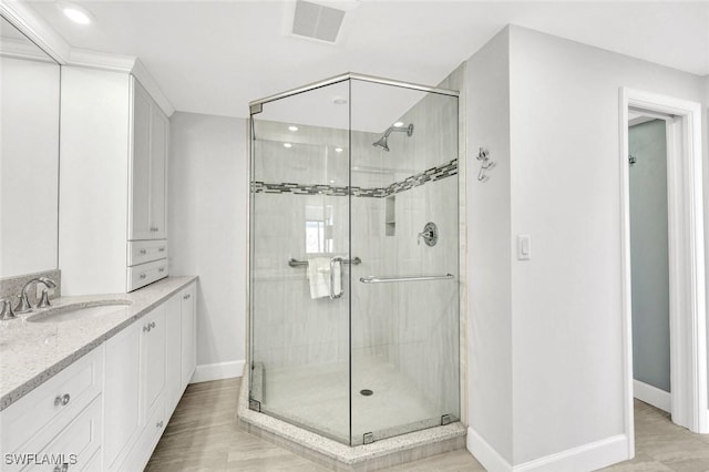 255 Park Shore Dr Unit 3-341, Naples, FL 34103 - full bath with a stall shower, baseboards, vanity, and recessed lighting