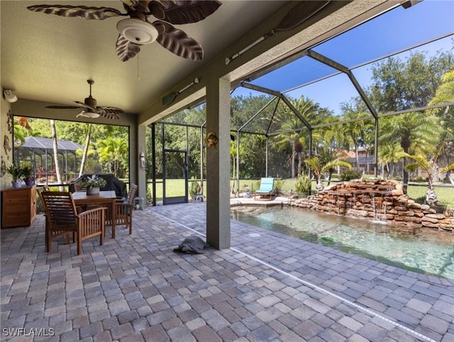 13708 Collina Ct, Estero, FL 33928 - view of patio featuring ceiling fan, an outdoor pool, a lanai, and outdoor lounge area