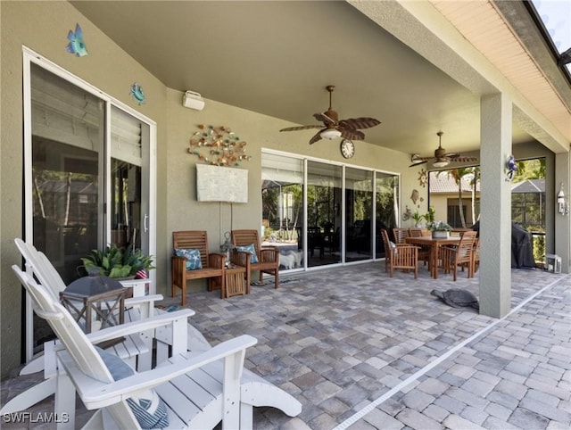 13708 Collina Ct, Estero, FL 33928 - view of patio / terrace with outdoor dining space and a ceiling fan