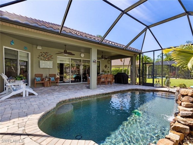 13708 Collina Ct, Estero, FL 33928 - outdoor pool with ceiling fan, a patio, and a lanai
