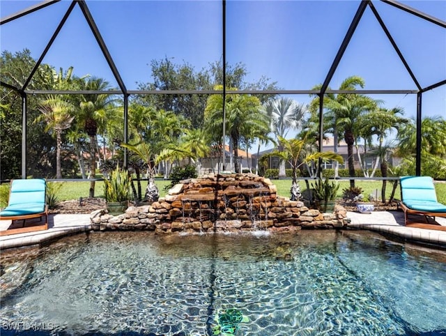 13708 Collina Ct, Estero, FL 33928 - outdoor pool featuring glass enclosure